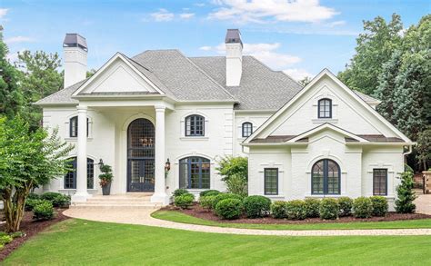 white brick house with gray roof